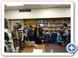17 Dr. Dinesh Loomba talks with students in the library