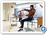 Demonstrating angular momentum with a spinning chair