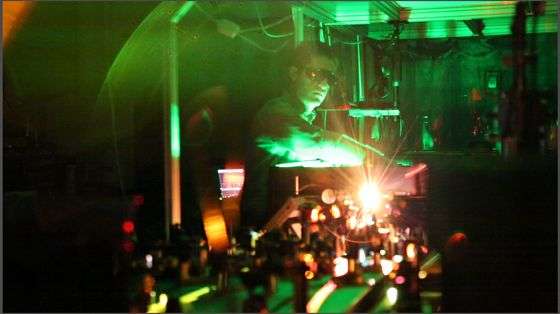 UNM Research Assistant Aram Gragossian tests lasers