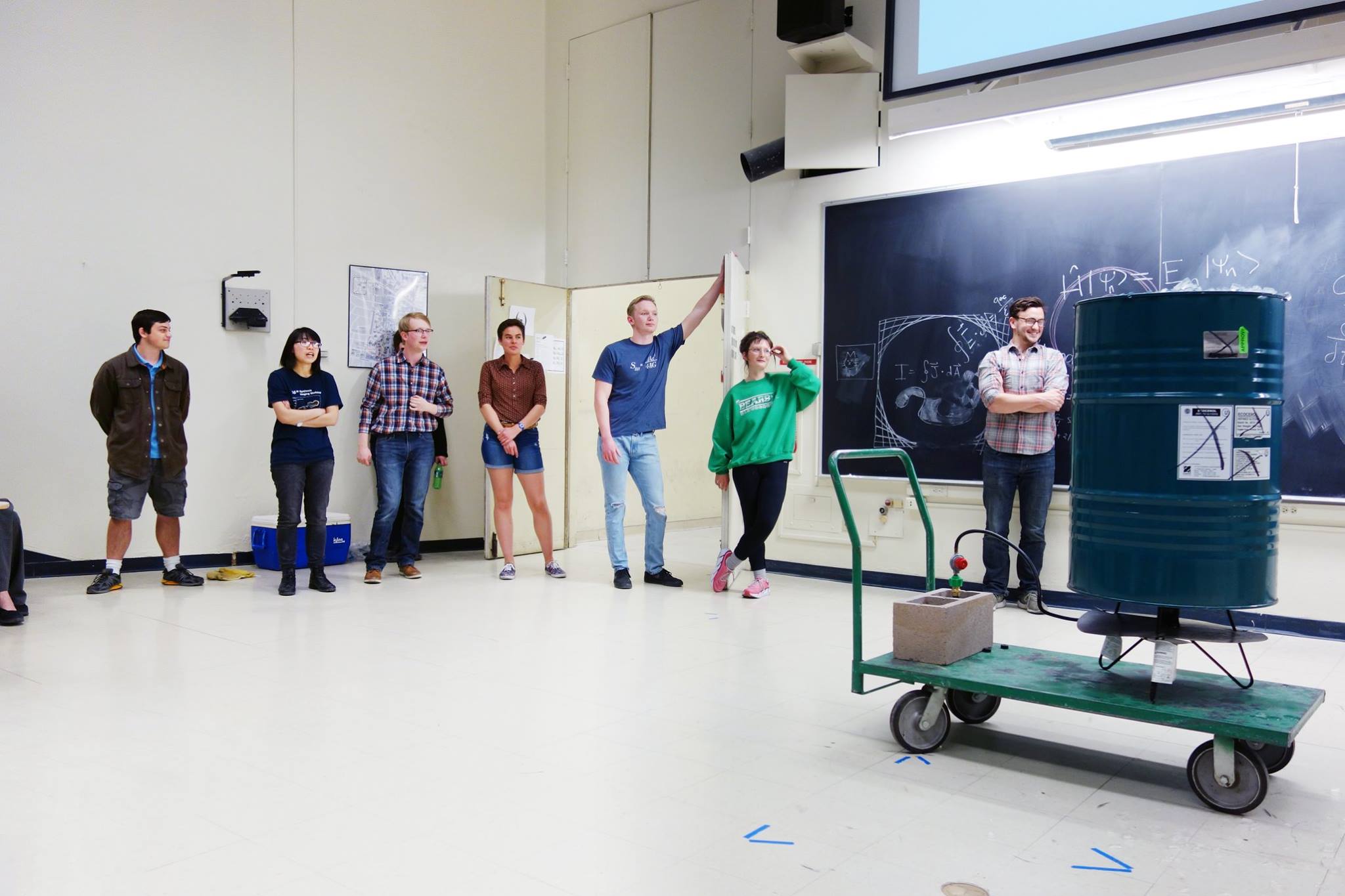 Students wait for a barrel implosion to occur