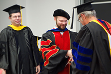 The convocation audience applauds new B.S. Physics degree recipient Luis Flores Sanchez