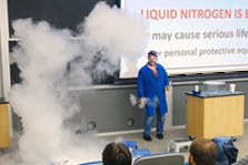 Staff member Hatem Babaa creates a steam cloud with liquid nitrogen