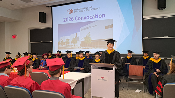 Kathrin Spendier ('12) addresses the 2026 Physics and Astronomy Department convocation