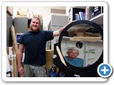 Grad student Dan Zirzow will use a new 24” telescope mirror for star calibration. Dr. McGraw is reflected in the mirror