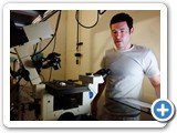 Grad student Peter Relich develops biomed instrumentation analyses protocol. Here he is with a laser microscope (Lidke)